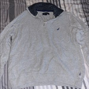 a grey pull over